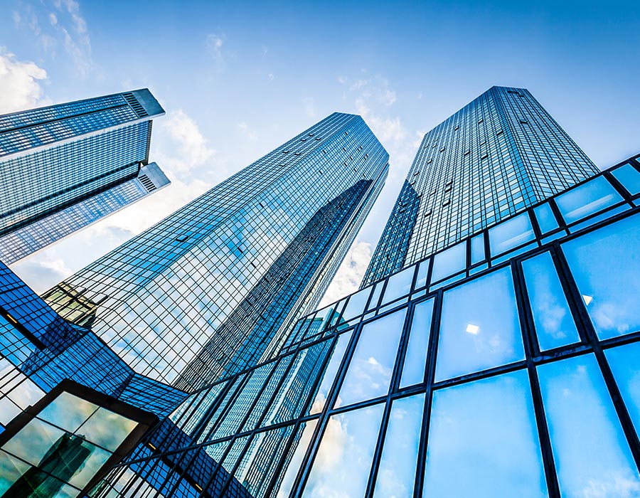 Skyscrapers with reflective glass under a blue sky