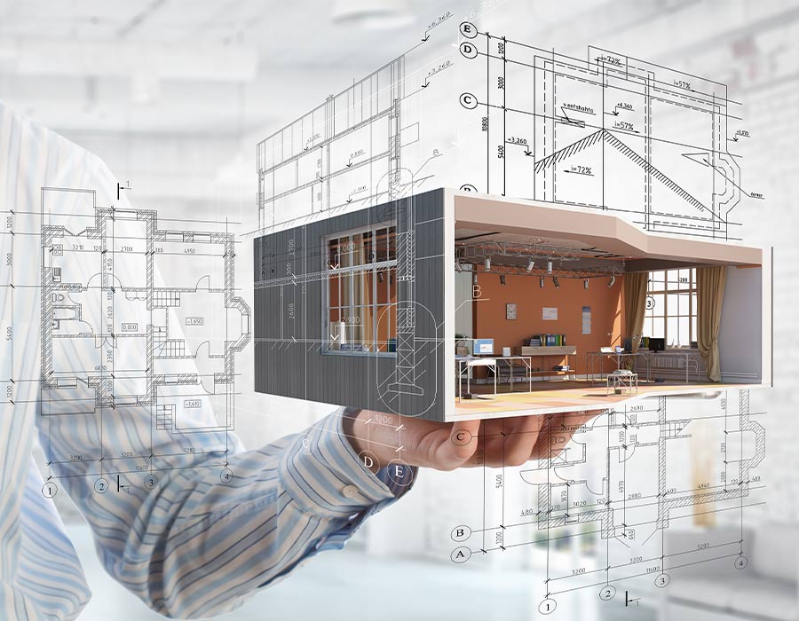 Architect holding a 3D building model with technical drawings
